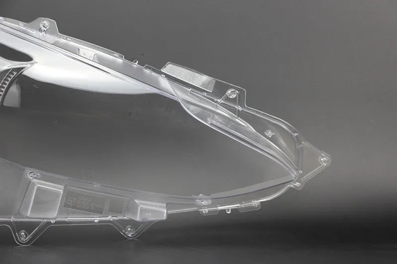 Mazda 3 Exela replacement headlamp cover with tube of snake glue adhesive.