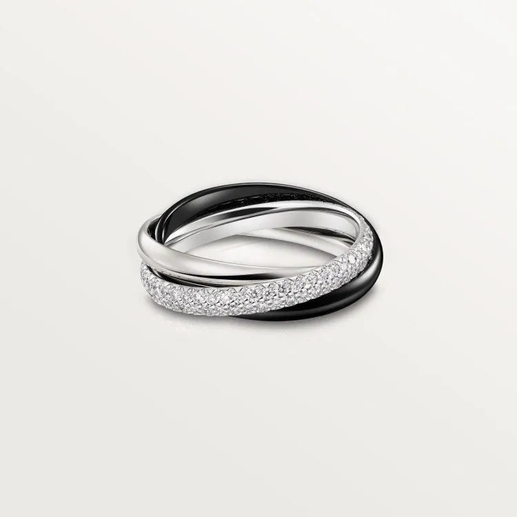 A geometric U-shaped silver couple ring fully set with diamonds on a black background.