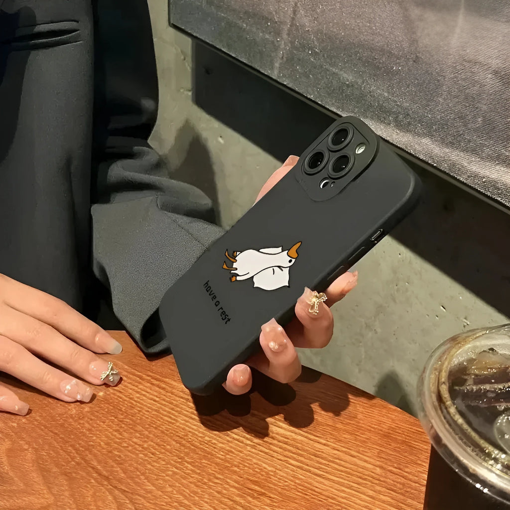 Black silicone iPhone case with a carved cartoon duck design on the back