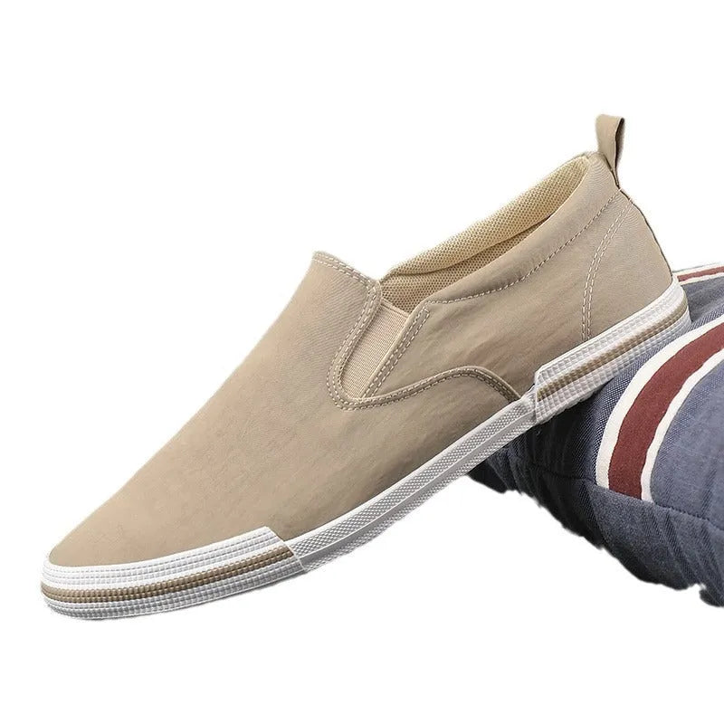 Men's low-top canvas sneakers in grey, black orange, and khaki colours with round toe and vulcanised rubber soles