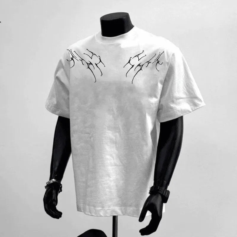 Man wearing a black loose-fit pure cotton short sleeve t-shirt with a printed design.