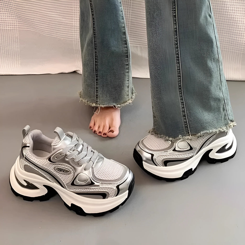 Women's silver mesh clunky platform sneakers with round toe and lace-up front.