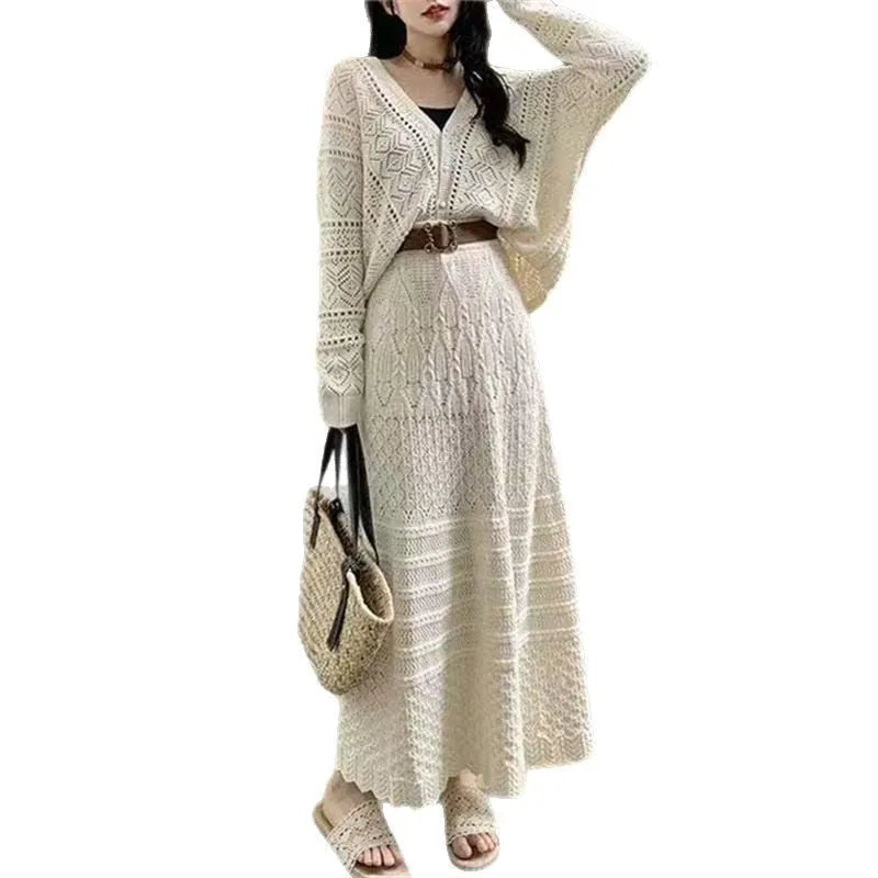 Beige two-piece set with hollowed-out knit top and mid-length lace-up skirt and belt