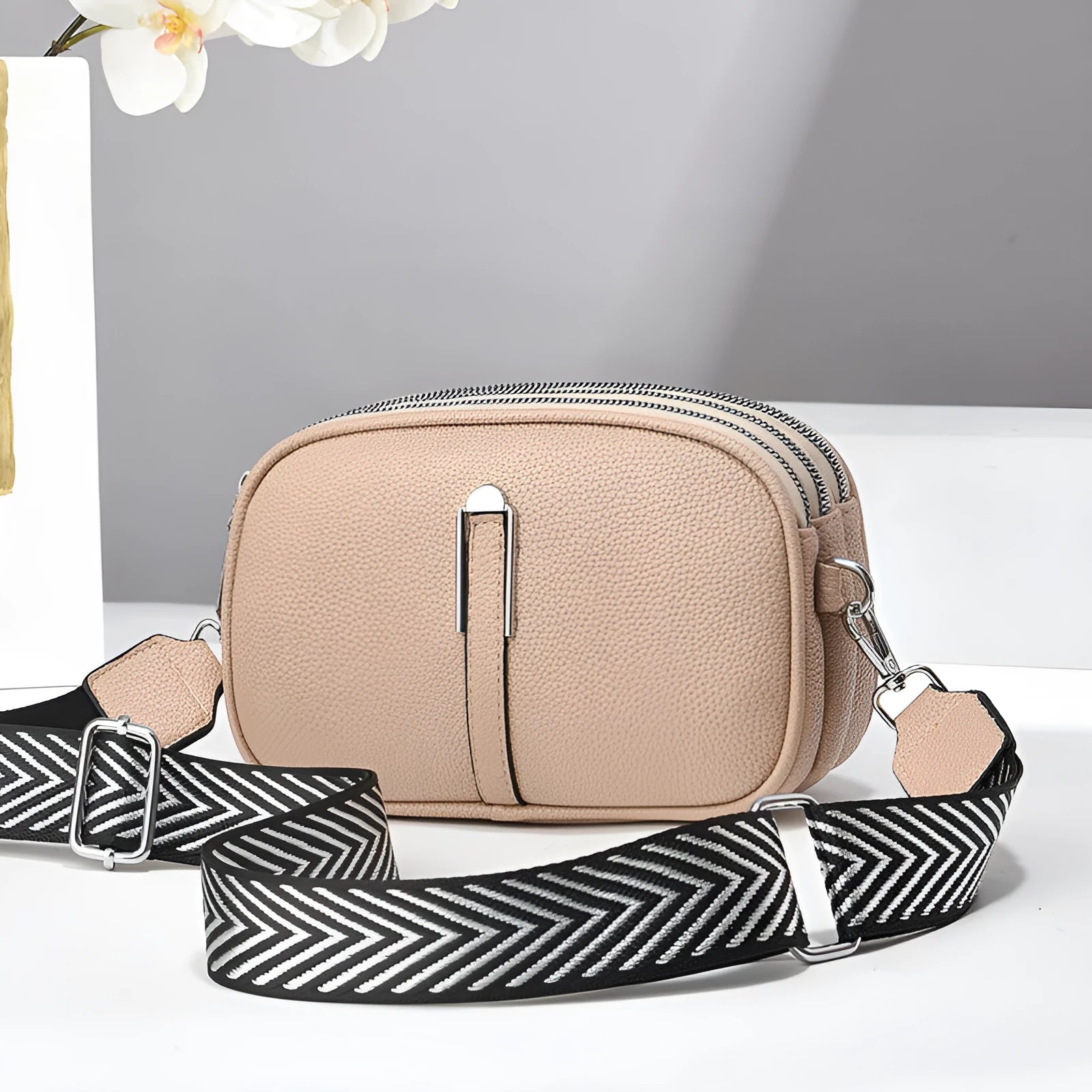 Women's soft PU crossbody bag in oval shape with multiple internal compartments and slit pocket