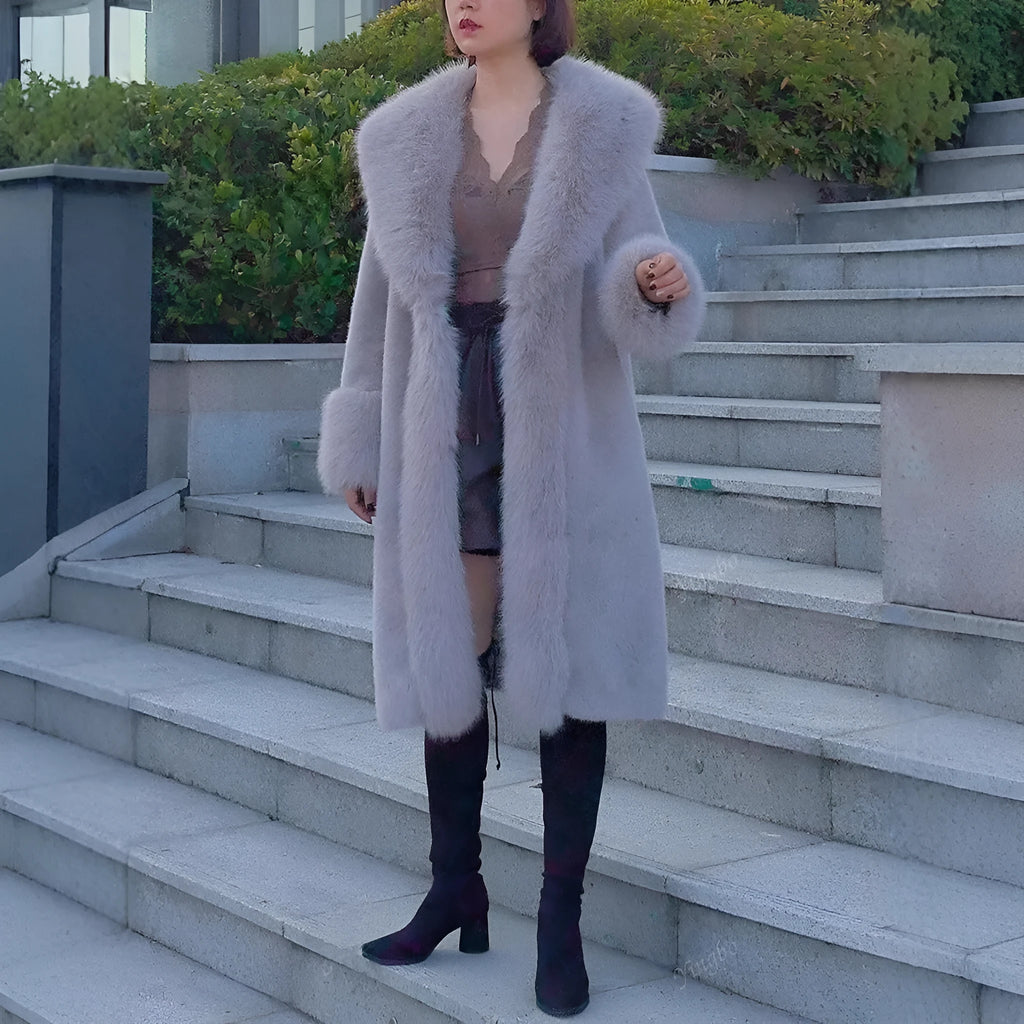 Women's grey faux rabbit fur and leather mid-length coat with a fur collar.