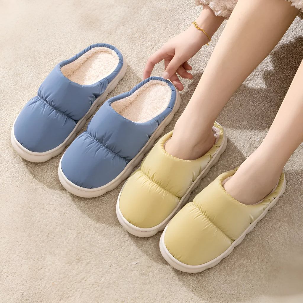 Blue down cotton slippers with artificial leather uppers, thick rubber soles, and plush lining for indoor winter wear.