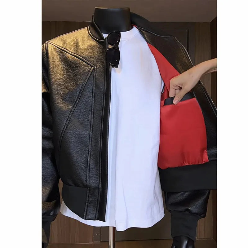 Men's black PU leather jacket with litchi grain texture, shown in a tight-fitting, extended length design.