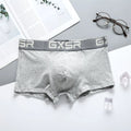 Men's purified cotton low waist boxer shorts in solid white, black, or grey, sizes M to XXL