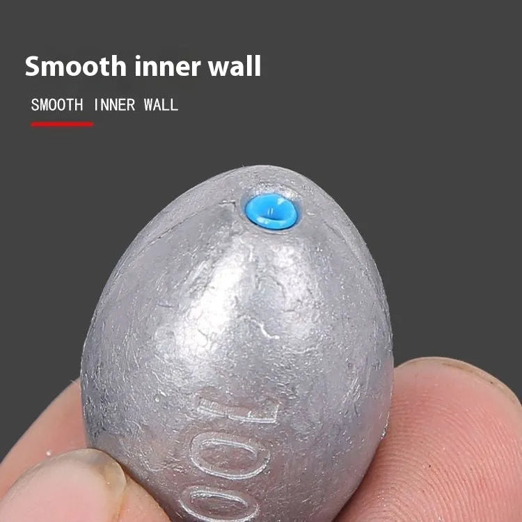 Olive coloured rugby-shaped fishing sinker with scale pattern, showing 10g to 150g weight options