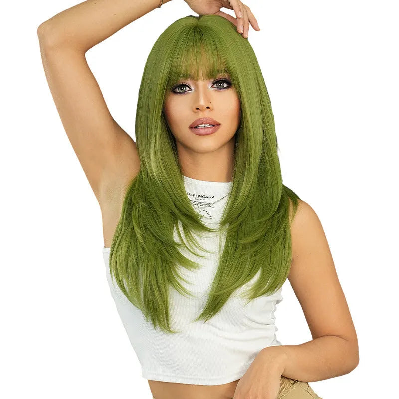 A woman wearing a long, straight vanilla green wig with a full fringe, measuring 63cm in length.