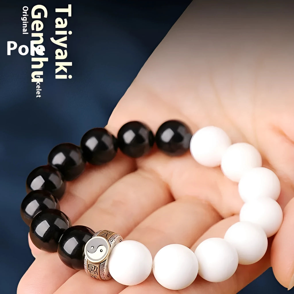 Black and white woven Taiji and Mantra bracelet on obsidian beads.