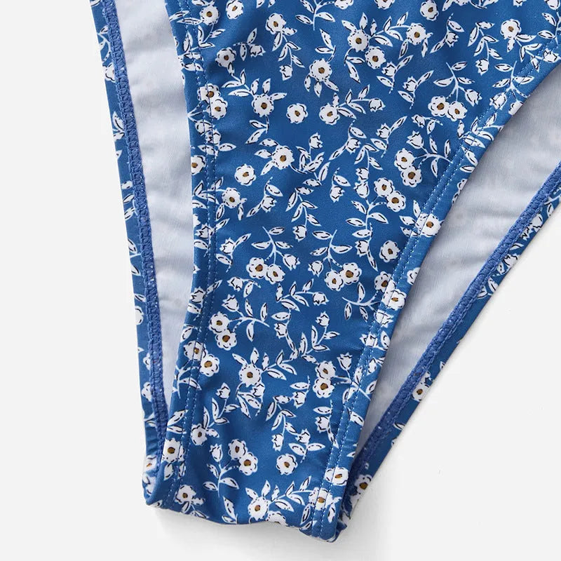 Blue women's polyester swimsuit three-piece set showing top and shorts, no steel rings.