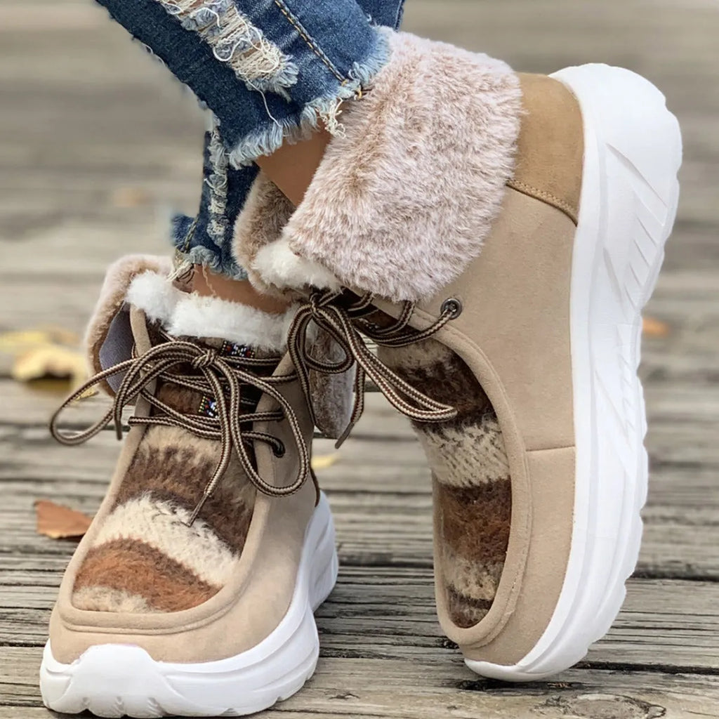 Women's beige lace-up snow boots with suede upper, thick rubber sole, and fuzzy lining.