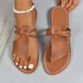 Women's solid colour woven beach slippers in black with rubber sole and PU upper