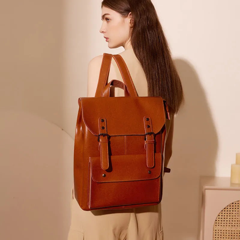 Women's leather computer backpack in black, brown, or coffee made from two-layer cowhide.