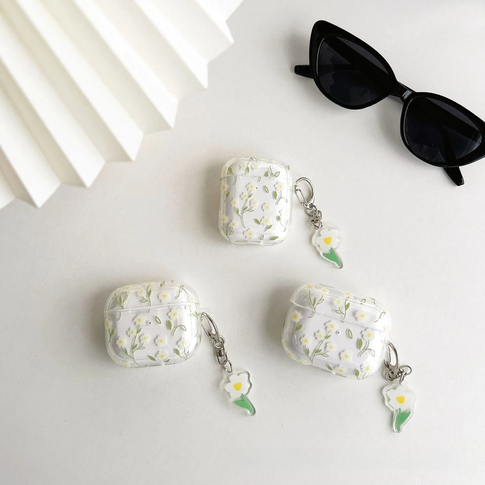 White transparent floral TPU protective cover for Apple AirPods showing decorative elements