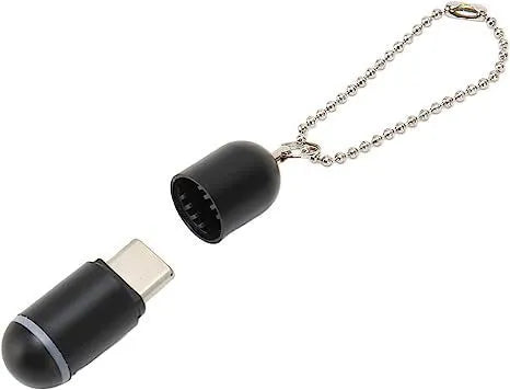Black capsule-shaped infrared universal remote control emitter with Lightning, type-c, and micro-USB interfaces.
