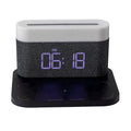 Black or white table lamp with integrated wireless phone charger, LED clock display, and nightlight functions