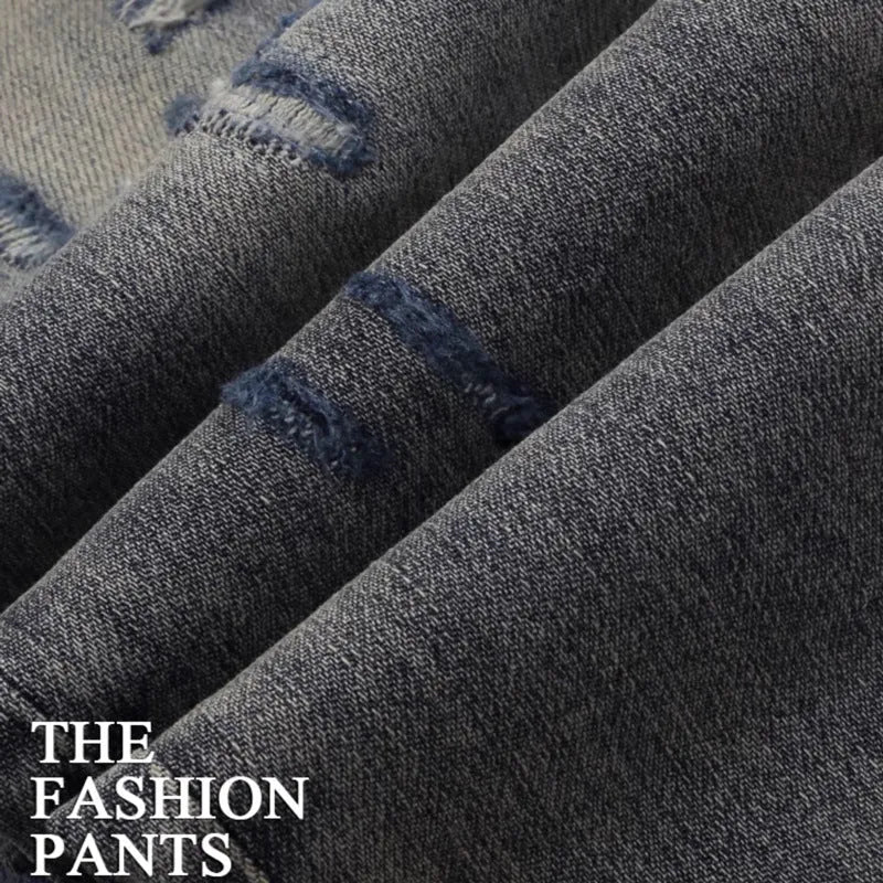 Men's slim fit distressed jeans with hole patches and embroidery in washed-out old colour