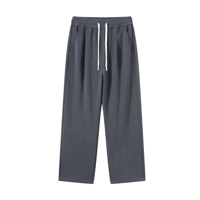 Men's apricot coloured loose-fit polar fleece-lined casual winter trousers on a white background.