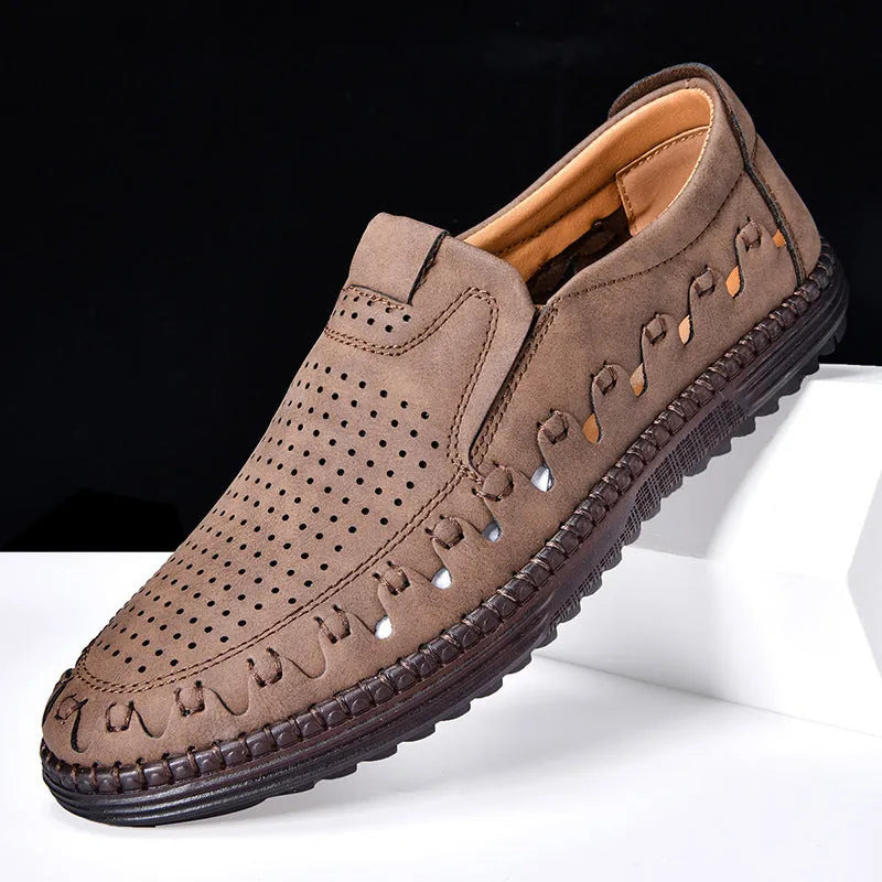 Men's brown slip-on casual shoes made of PU leather with a flat sole and round toe cap.
