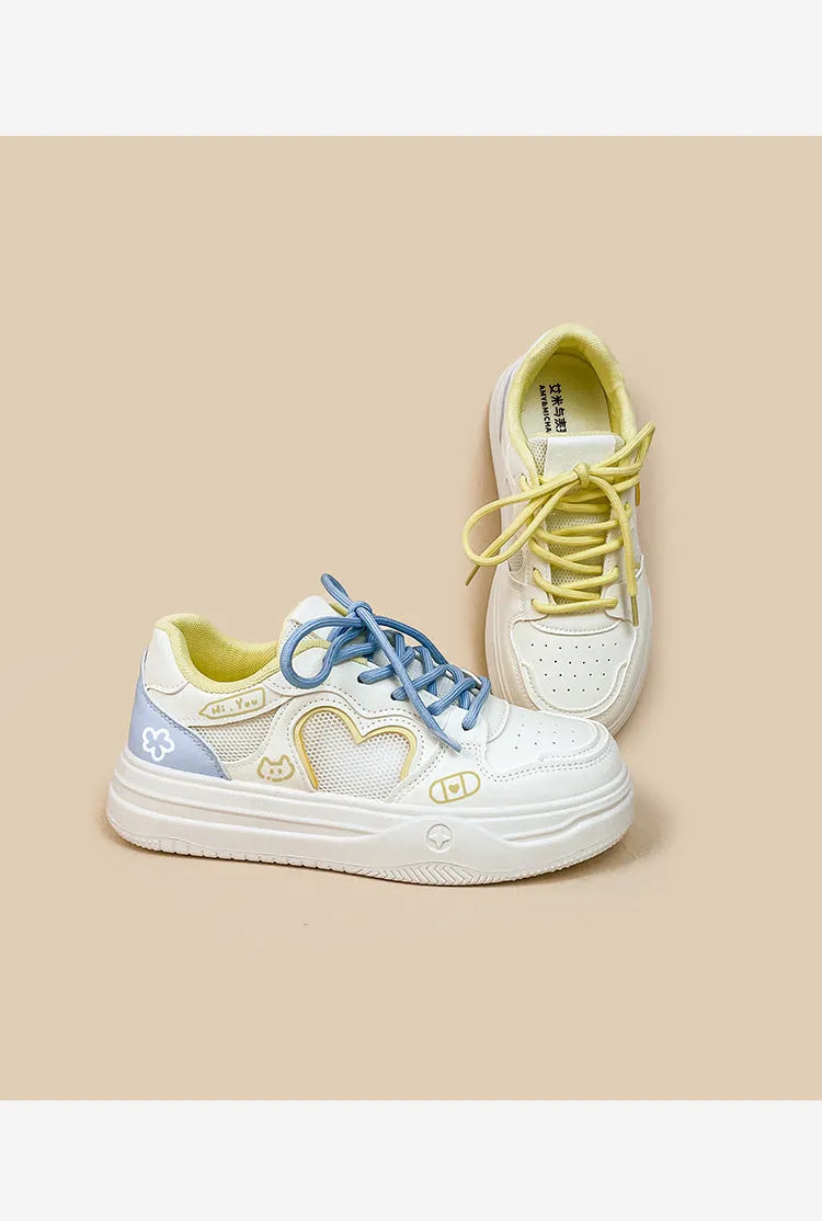 Meow Rabbit Sea Salt Cheese coloured sneakers with mesh cross straps and a thick rubber sole.