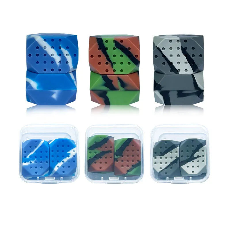 Two silicone camouflage-style facial muscle fitness balls for jaw training in transparent boxes.