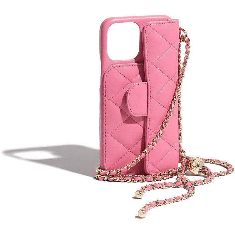 Imitation leather iPhone compatible phone case with long chain and golden ball detail in black, pink, yellow, or blue
