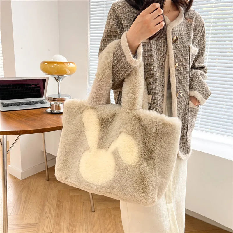 Plush shoulder bag with cartoon rabbit ears design in solid colour