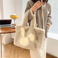 Plush shoulder bag with cartoon rabbit ears design in solid colour