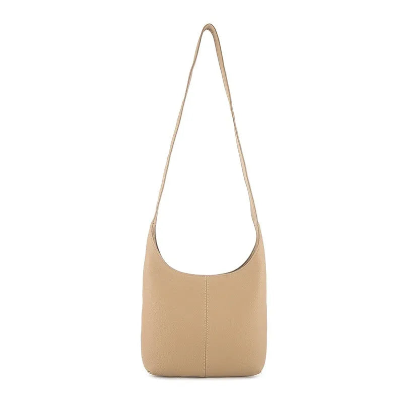 Genuine top grain leather women's crossbody bag in vertical square urban minimalist style with zip closure, shown in black.