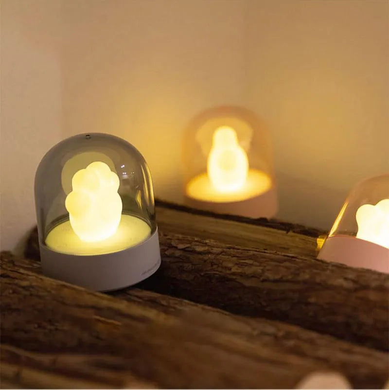 Pink cat paw shaped night light with USB charging cable and music box function