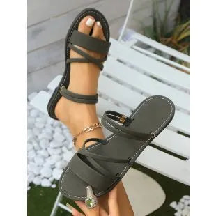 Women's plus size sandals with flip-toe buckle and flat cross-strap in black, brown or green
