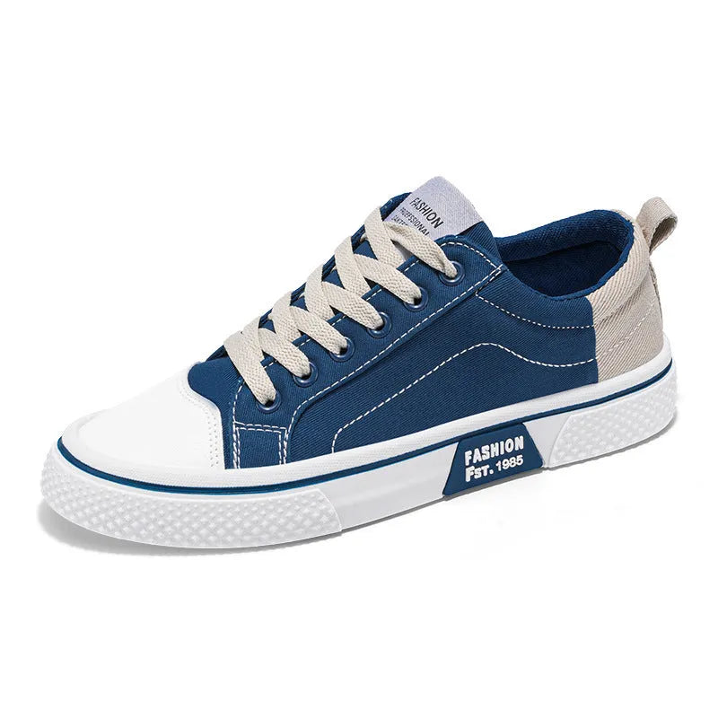 Men's low-top casual canvas skateboard shoes in blue with round toe and front lace-up closure.