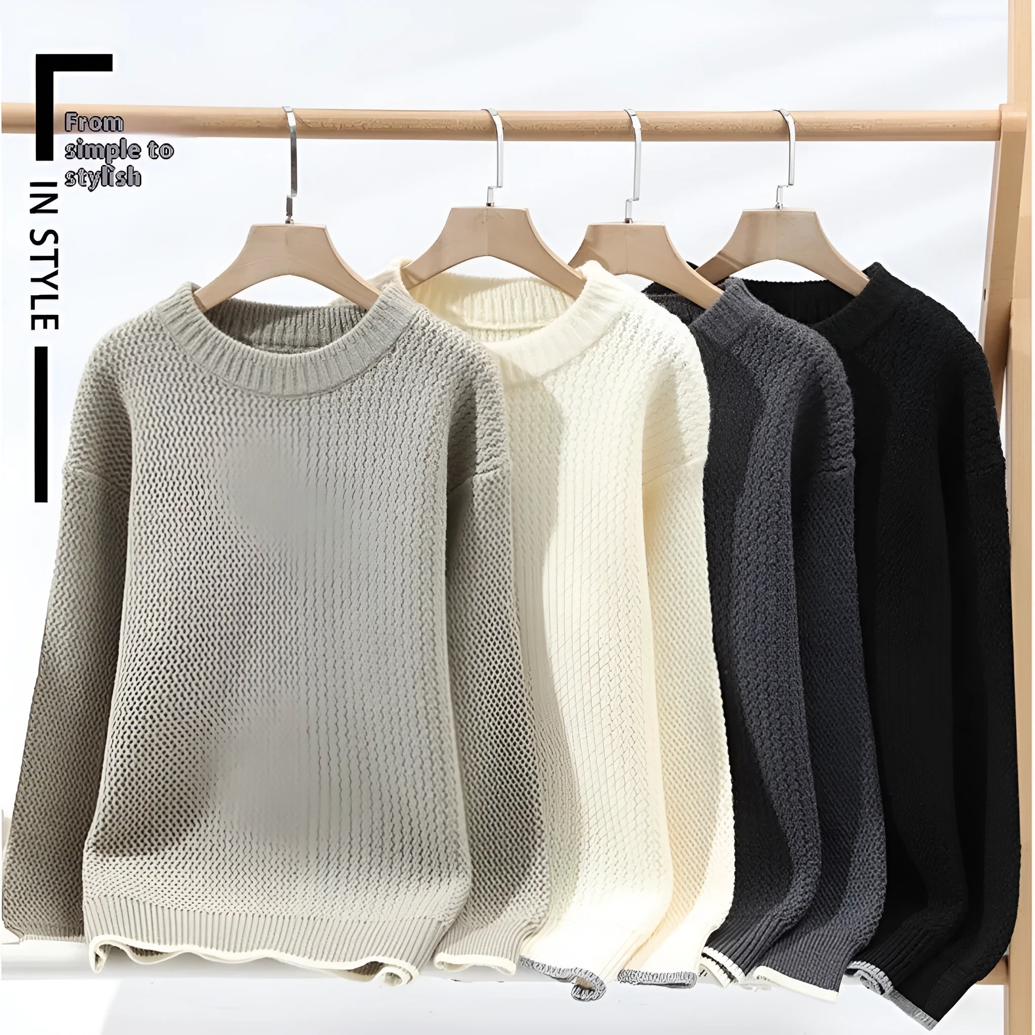 Man wearing a grey loose fit round neck long sleeve pullover sweater