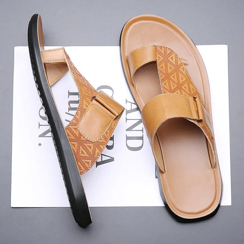 Men's simple beach slippers in light brown cowhide with a rubber sole, shown from the side.