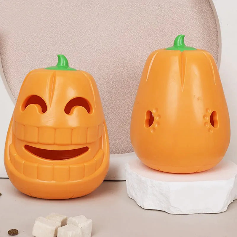 Orange Halloween pumpkin shaped interactive dog chew toy with treat-dispensing funnel