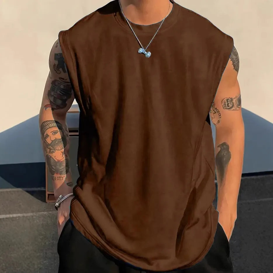 Men's loose apricot-coloured cotton tank top on a hanger.