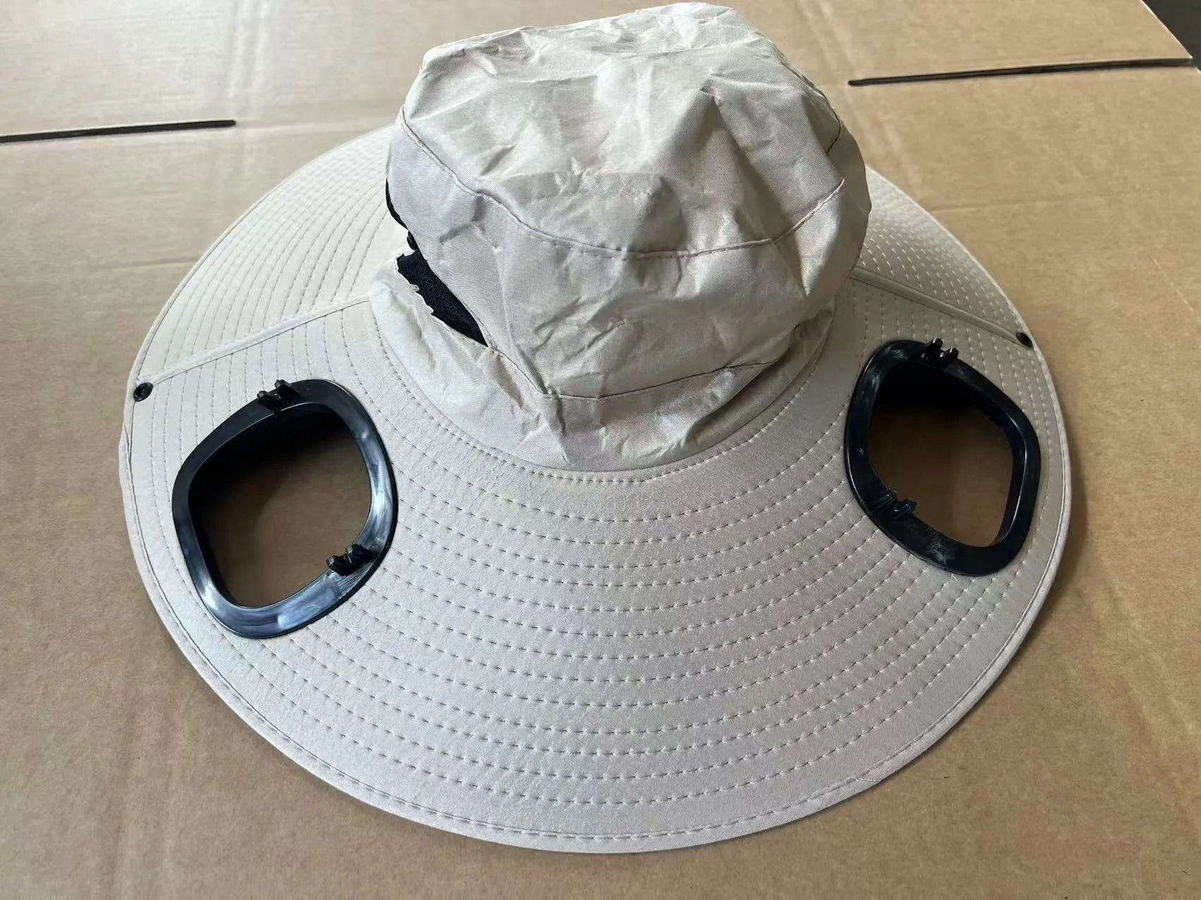 Men's grey solar fan cap with wide brim showing integrated cooling system
