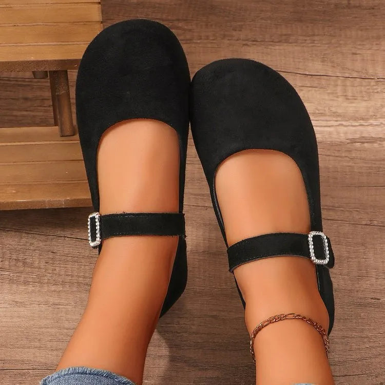 Black canvas fisherman shoes with rubber sole showing low-top design