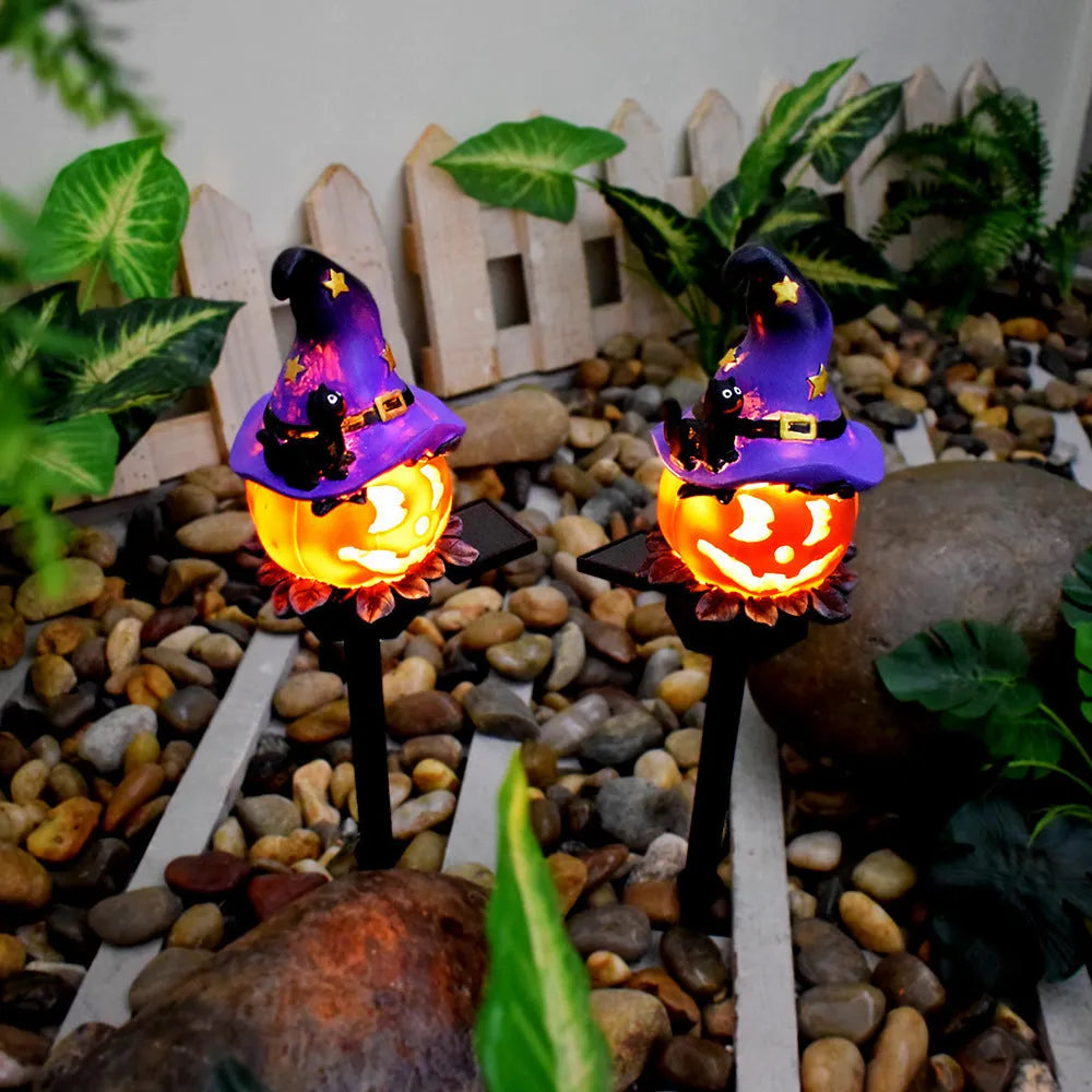Solar Halloween pumpkin lantern on ground stake, wrought iron outdoor path light with 40x40mm solar panel, IP55 waterproof.