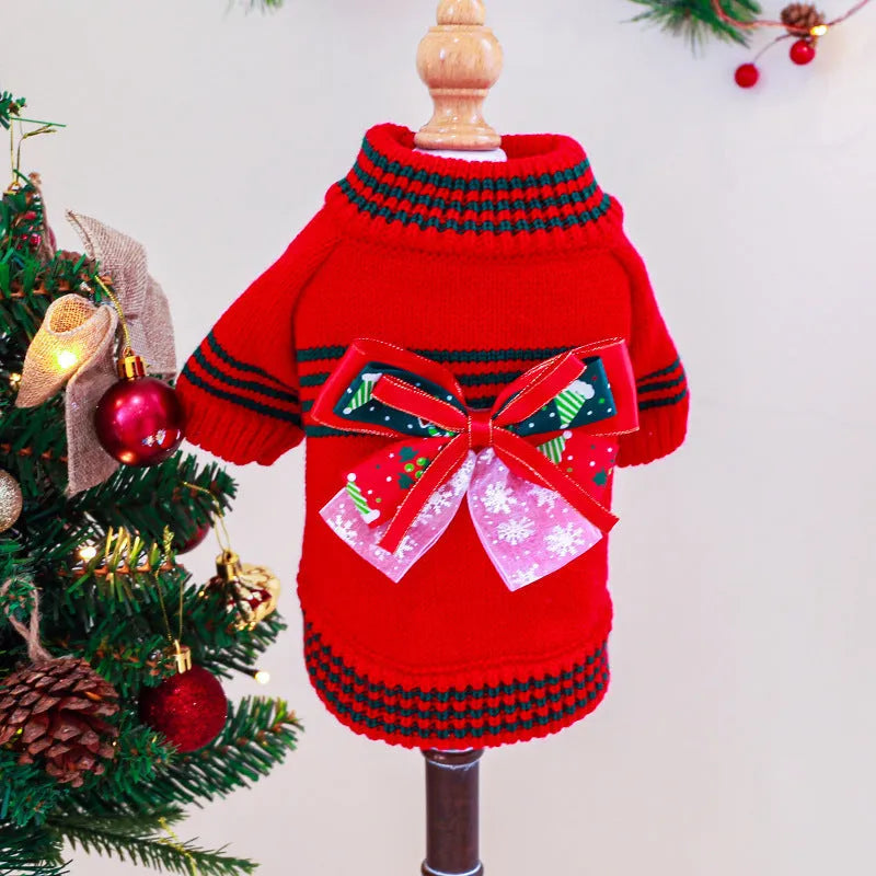 Red and green Christmas dog jumpers with festive print on a small dog model.