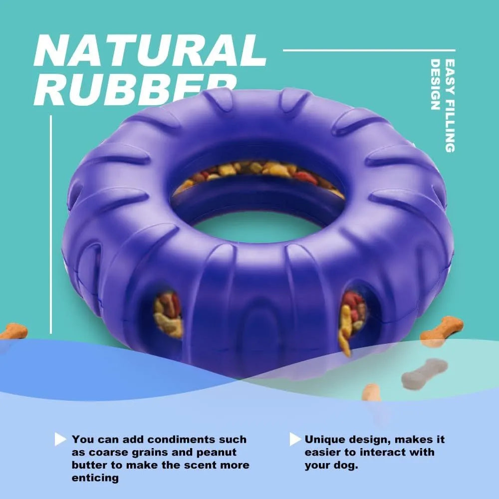 Blue rubber tyre-shaped dog chew toy with oval openings for slow feeding.