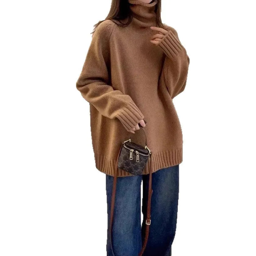 Women's loose grey turtleneck sweater with a textured curling collar and 3D pattern detail.