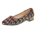 Women's black and white canvas flats with flower pattern, pointed toe, and low-cut design