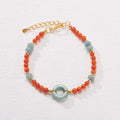 Women's South Red Agate bracelet with geometric patterns and an adjustable safety buckle.