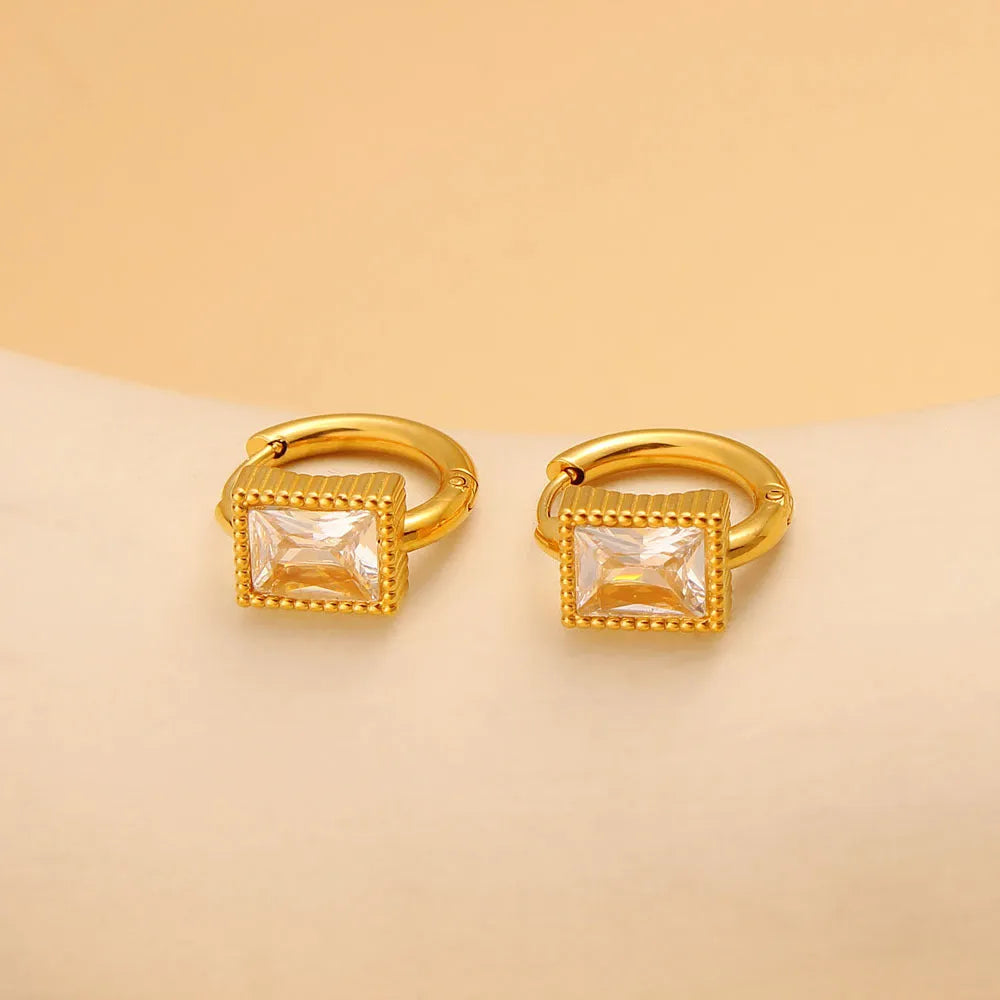 Square geometric stainless steel earrings with round ring details in white, black, or green.