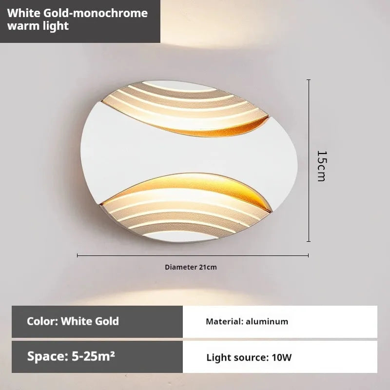 A modern aluminium wall lamp mounted beside a bed, showcasing its minimalist design.