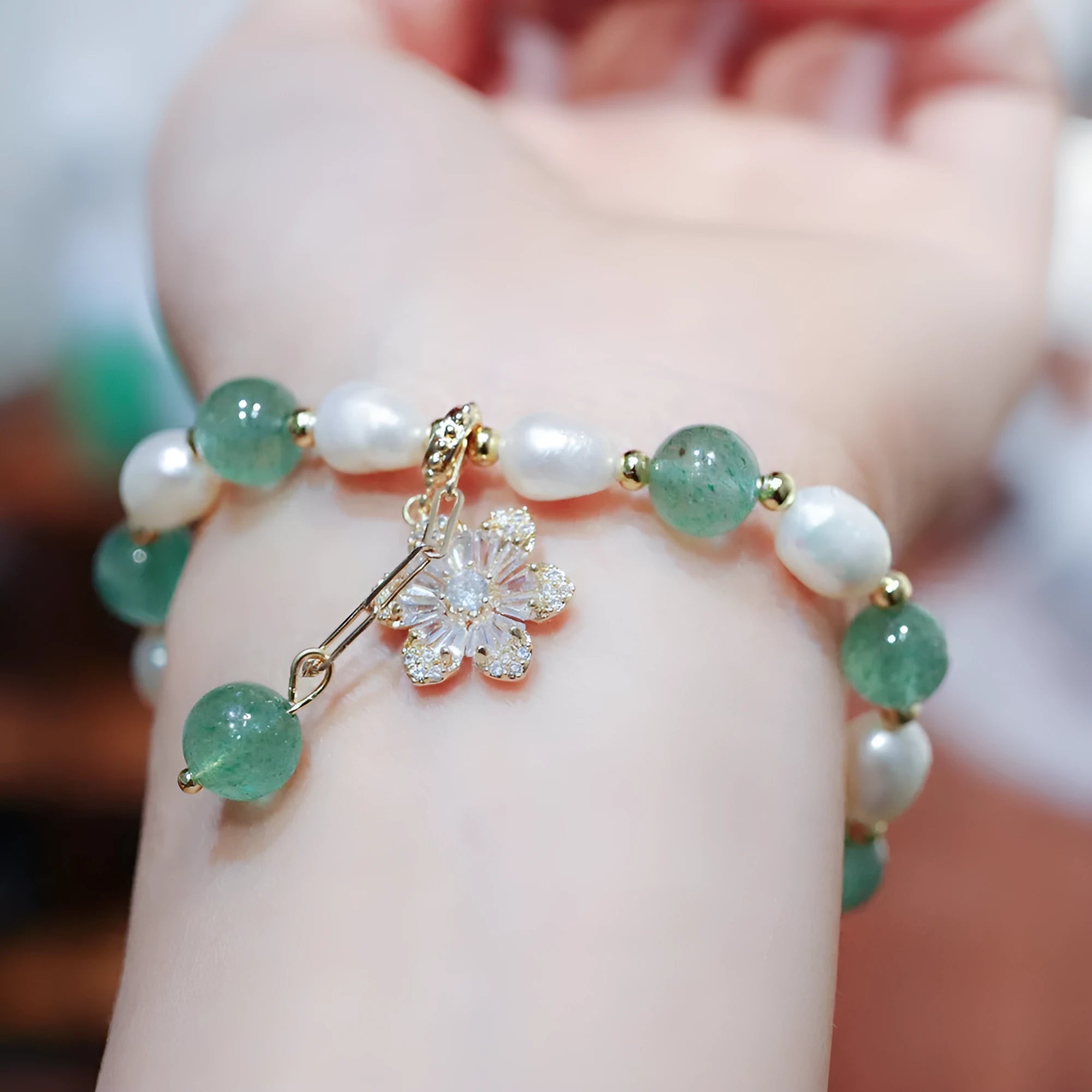Green strawberry freshwater pearl bracelet with Chinese knot design and jade flower decorations