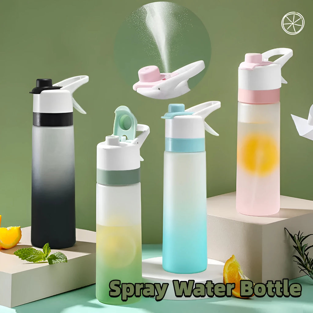 Large pink plastic spray water bottle with a handle strap and leakproof lid on a gym bag.